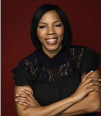 Smiling woman in black lace blouse against red background